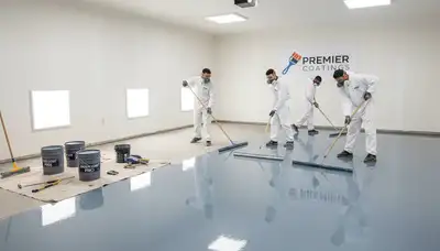 Epoxy floor coating in Oak Park, IL garage with professional house painters applying durable finish